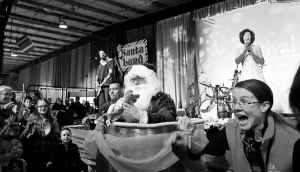 Santa Jumps out of a cake!